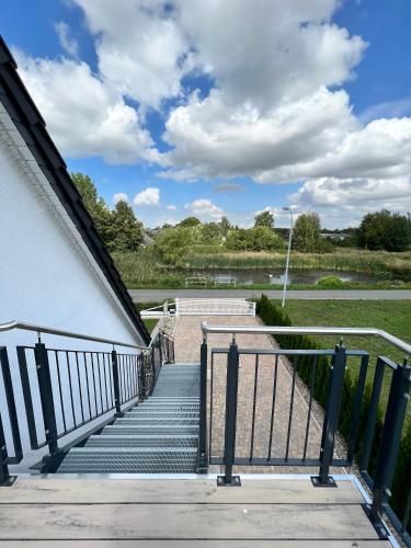 a set of stairs leading up to a building at „Holzwurm-Paradies“ in Ivenack