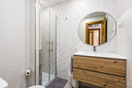 a bathroom with a sink and a mirror at Fuengirola center, 3 bedrooms, and parking in Fuengirola