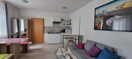 a living room with a couch and a table at Appartement Ernst in Celle