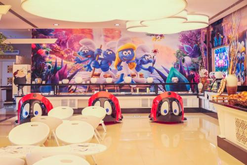 a childrens restaurant with a mario kart mural at Crystal Prestige Elite in Kemer