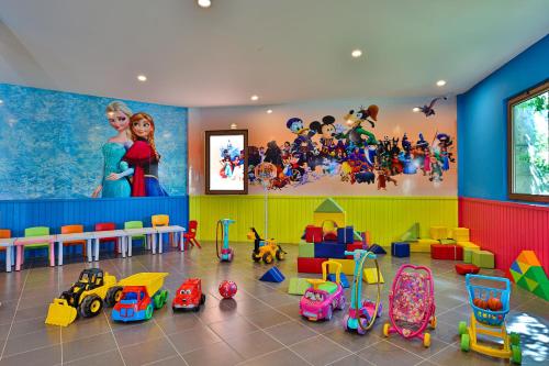 a play room with toys and a mural of disney at Crystal Prestige Elite in Kemer