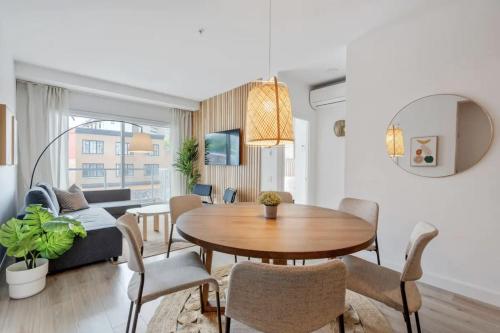 a living room with a table and a couch at INITIAL / ARTWOOD / Centre-ville de Quebec in Quebec City