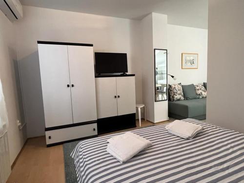 Posteľ alebo postele v izbe v ubytovaní RETRO Apartments