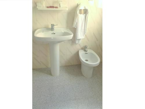 a bathroom with a sink and a toilet at Hostal Centro Ejido in El Ejido