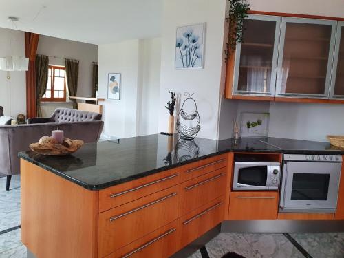 a kitchen with an island with a counter top at Ferienhaus Panorama in Rechnitz