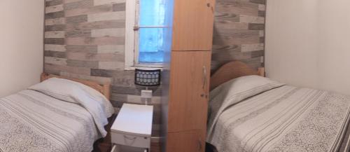 Ένα ή περισσότερα κρεβάτια σε δωμάτιο στο Hostal del Viajero