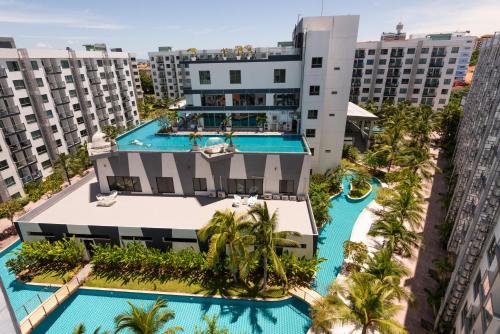 an aerial view of a resort with two swimming pools at Rare XXXL Swimming Pools Resort - 500Mbps Blazing Fast Free WIFI - Top Floor Pool View Balcony - Gym - Sauna - Kids Playground - Supermarkets in Pattaya South