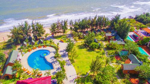 an aerial view of an amusement park next to the beach at Long Hải Channel Beach Resort in Long Hai