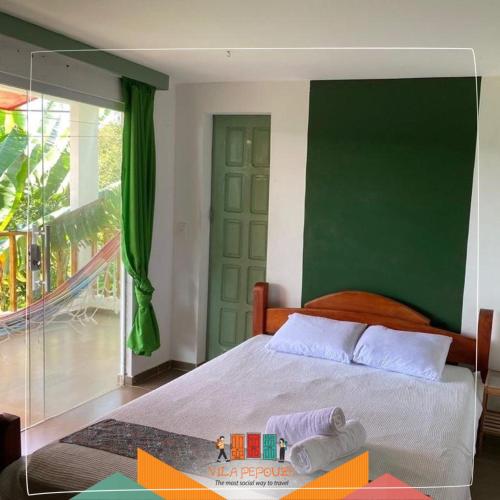 Una cama o camas en una habitación de Vila Pepouze Hostel