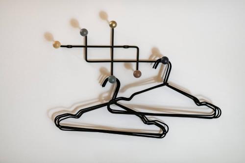 a metal towel rack with two pans on it at Ozon Gudauri in Gudauri