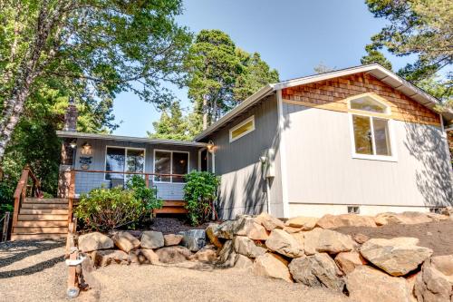 a home with a stone retaining wall at Gray Whale Cove MCA 935 in Manzanita