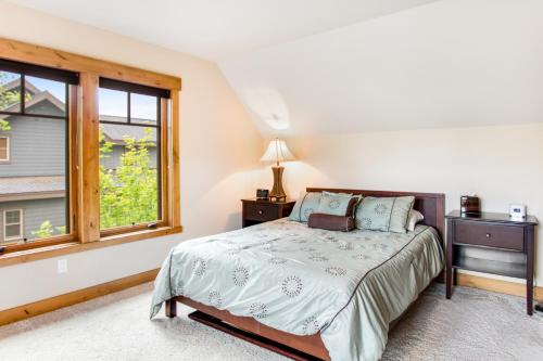 a bedroom with a bed and a window at Cascade Serenade at Suncadia Resort in Cle Elum