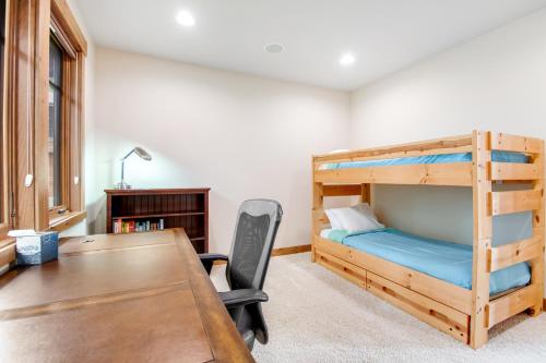 a bedroom with a desk and a bunk bed at Cascade Serenade at Suncadia Resort in Cle Elum