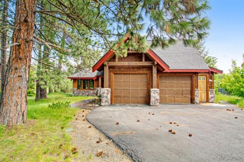 a garage in front of a house with a tree at Cascade Serenade at Suncadia Resort in Cle Elum