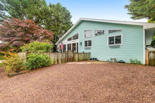 a blue house with a fence in front of it at Dewey Beach 102 Jersey St in Dewey Beach