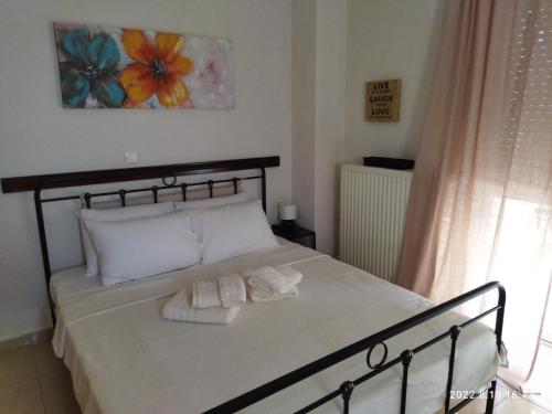 Postel nebo postele na pokoji v ubytování Nafplio BREEZE Άνετη διώροφη κατοικία από 4 έως 9 επισκέπτες