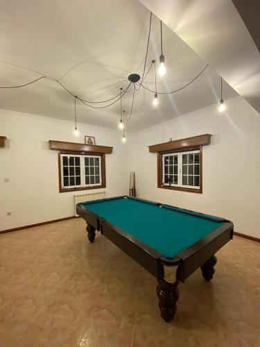 a room with a pool table in it at Casa da presa in Ponte de Lima