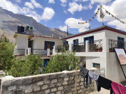 a building with clothes hanging on a wall at Nawang HomeStay in Kaza