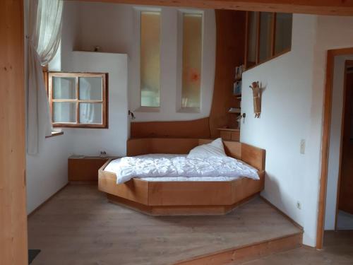 a bedroom with a bed in the corner of a room at Ufering 60 in Teisendorf