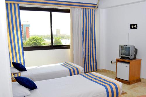 A television and/or entertainment centre at Marhaba Palace Hotel