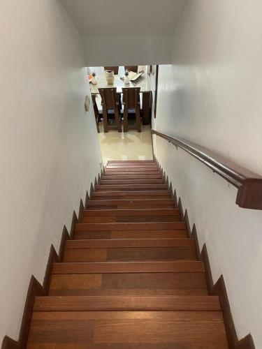 a staircase leading up to a room with a table at #6 Ferguson Rd - Townhouse in Nassau