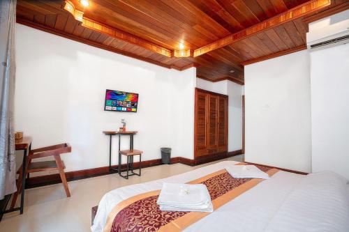 Ένα ή περισσότερα κρεβάτια σε δωμάτιο στο P5 Angkor Residence