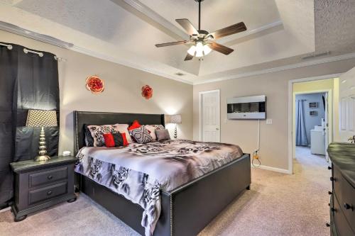a bedroom with a bed and a ceiling fan at Covington Abode Less Than 30 Mi to Stone Mtn Park! in Covington