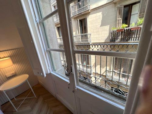a balcony with a view of a building at The MO GOTIC in Barcelona