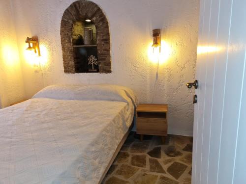Ένα ή περισσότερα κρεβάτια σε δωμάτιο στο Andros Serenity
