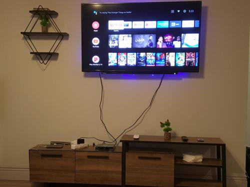 a flat screen tv hanging on a wall at Tourist rent Apartment in Istanbul