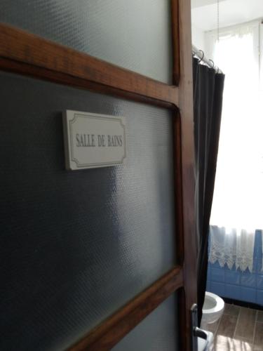 a door with a sign that says wife of laws at Notte Rosa Suites & Relax in Fornovo di Taro