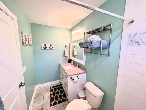 a bathroom with a toilet and a sink at The Absolute Best Home Away From Home Pet Friendly!!! in Wilmington