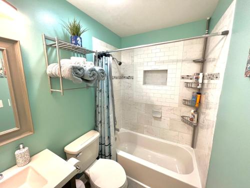 a bathroom with a shower and a toilet and a sink at The Absolute Best Home Away From Home Pet Friendly!!! in Wilmington