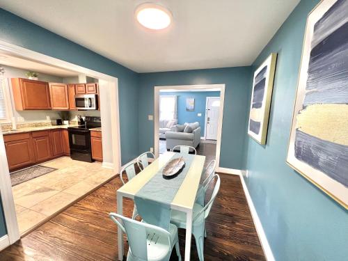 a kitchen and dining room with a table and chairs at The Absolute Best Home Away From Home Pet Friendly!!! in Wilmington