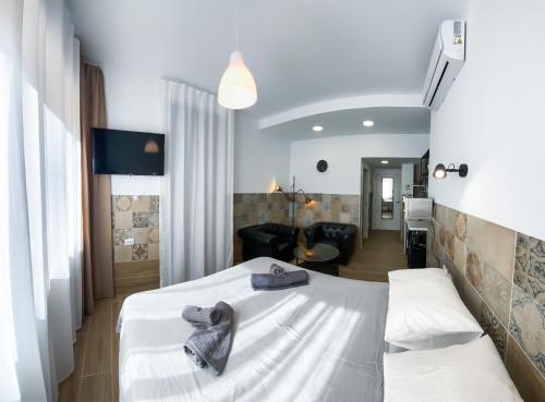 A bed or beds in a room at Apartamentos Pueblo Mar