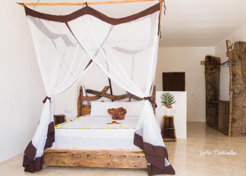 Letto o letti in una camera di Uroa Zanzibar Vera Beach Hotel by Moonshine