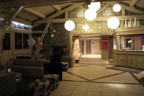 a lobby with a christmas tree in a building at Résidence Montana Premier in Val Thorens