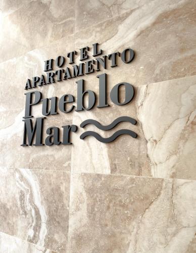 a sign for the hotel argentina pueblo marino at Apartamentos Pueblo Mar in Calpe