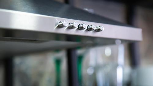 a row of knobs on a stove in a kitchen at Apartamentos Pueblo Mar in Calpe
