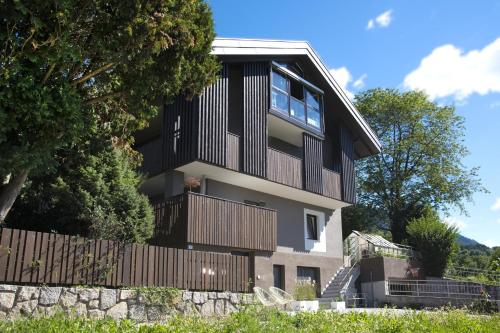 a large house with a fence and trees at Apartment Peskoller in Falzes