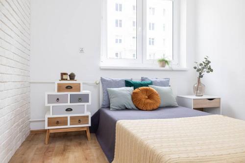 Posteľ alebo postele v izbe v ubytovaní Roomsy Świętojańska