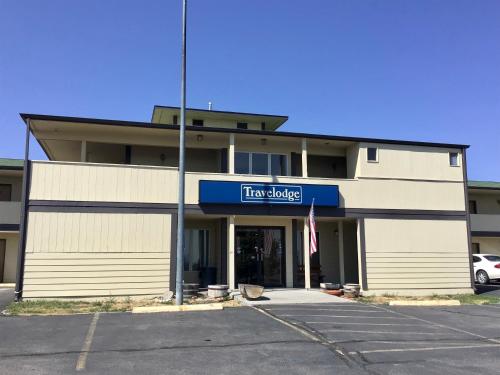 a fire building with a sign that reads fire laughing at Travelodge by Wyndham Three Forks in Three Forks