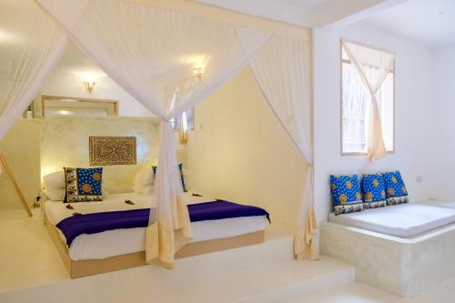 Ένα ή περισσότερα κρεβάτια σε δωμάτιο στο Sharazad Oasis Retreat