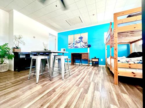 a room with a table and a bunk bed at WHOLE Family - Rosemont in Sacramento