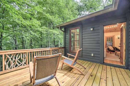 a deck with two chairs and a house at Secluded Sapphire Chalet with Game Room and Decks in Sapphire