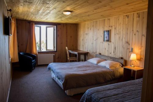 Postel nebo postele na pokoji v ubytování Hostal Mundo Nuevo
