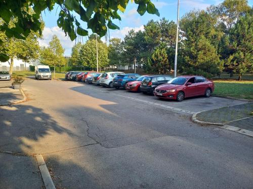 a row of cars parked in a parking lot at Apartman Bruna in Zagreb