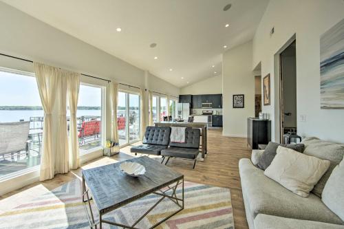 a living room with a couch and a table at Modern Cedar Creek Lake Retreat with Panoramic View! in Malakoff