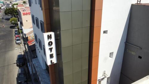 an aerial view of a building with a hotel sign at Hotel Grand One Plaza in Tijuana