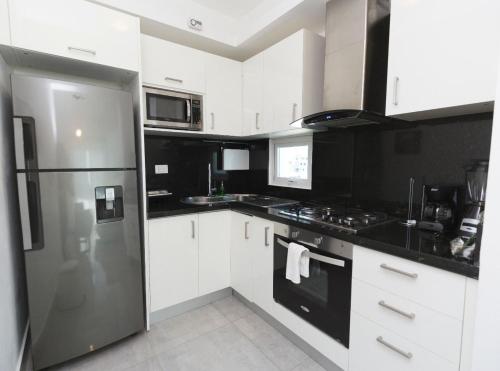Η κουζίνα ή μικρή κουζίνα στο Soha suites I
